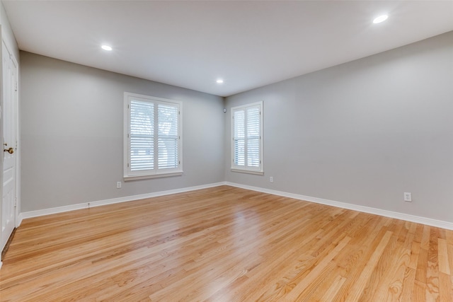 unfurnished room featuring light hardwood / wood-style floors