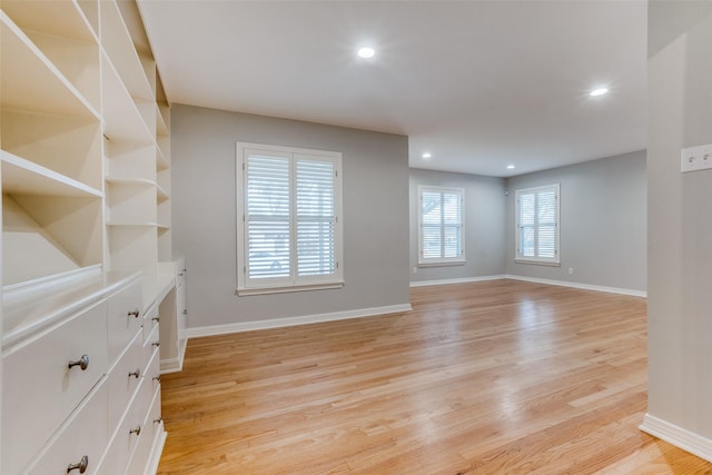 unfurnished room with light hardwood / wood-style floors