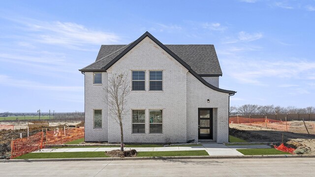 view of front of home with a yard