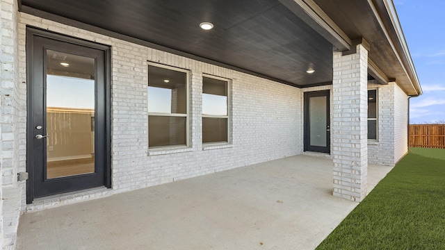 view of patio featuring fence