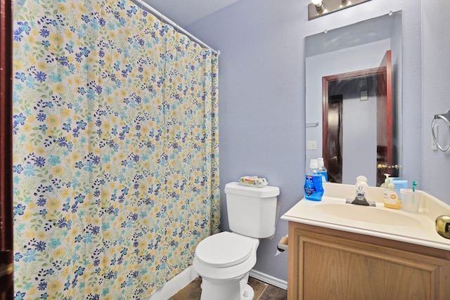 bathroom with toilet and vanity