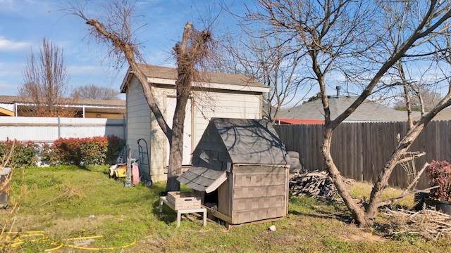 view of outbuilding featuring a yard