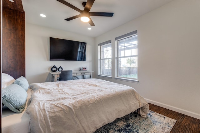 bedroom featuring ceiling fan and dark hardwood / wood-style floors