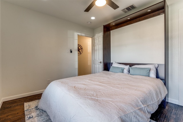 bedroom featuring ceiling fan and dark hardwood / wood-style flooring