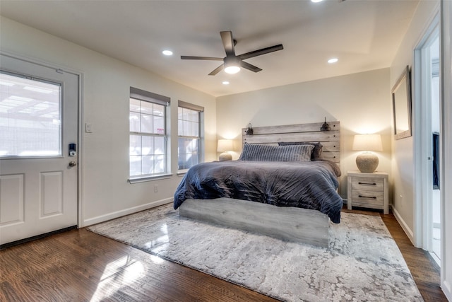 bedroom featuring ceiling fan and dark hardwood / wood-style floors