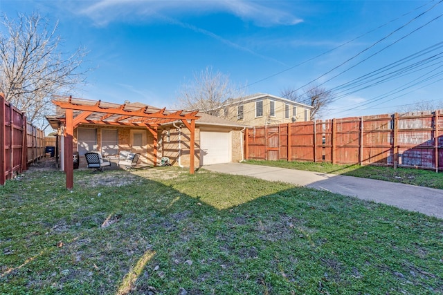 view of yard featuring a pergola and a garage