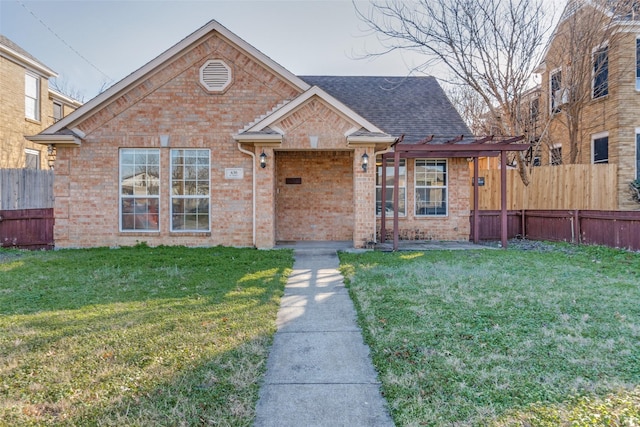 view of front of home with a front lawn and a pergola