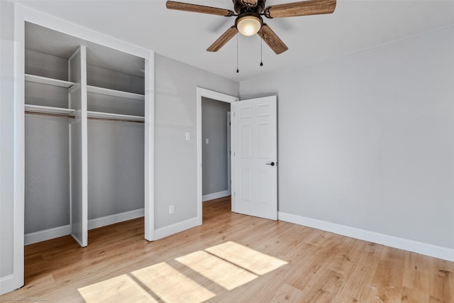 unfurnished bedroom featuring light hardwood / wood-style floors, a closet, and ceiling fan