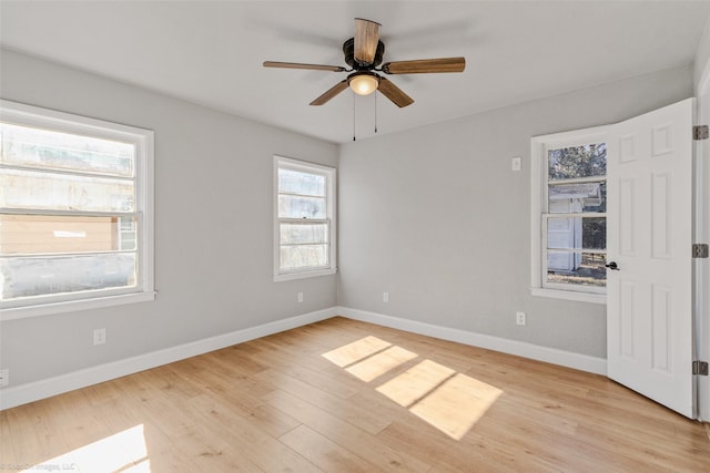 empty room featuring ceiling fan and light hardwood / wood-style flooring