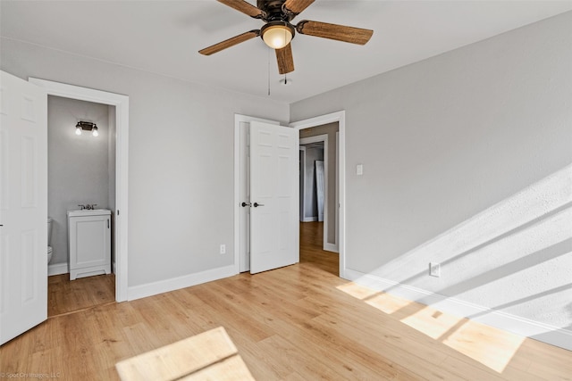 unfurnished bedroom with ceiling fan and light hardwood / wood-style flooring