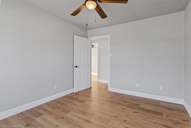 unfurnished room featuring ceiling fan and light hardwood / wood-style flooring