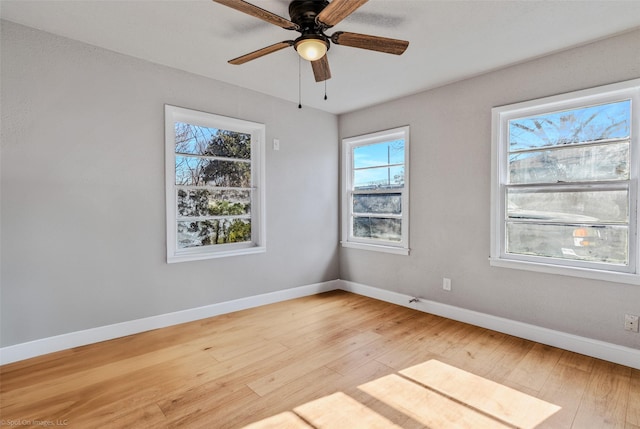 spare room with light hardwood / wood-style flooring and ceiling fan