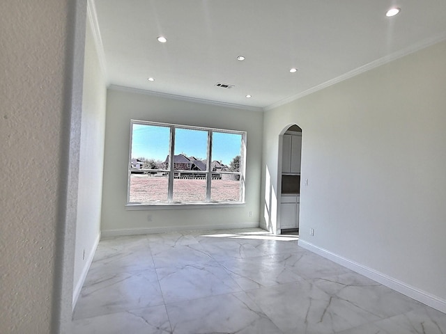 spare room with ornamental molding