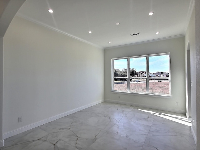 unfurnished room with ornamental molding