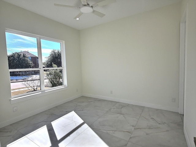 unfurnished room with ceiling fan