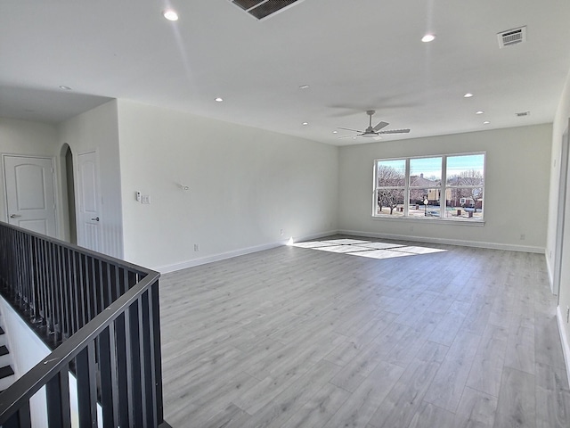 unfurnished room featuring light hardwood / wood-style floors and ceiling fan