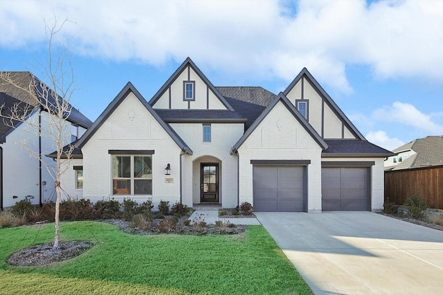 tudor house featuring a front yard