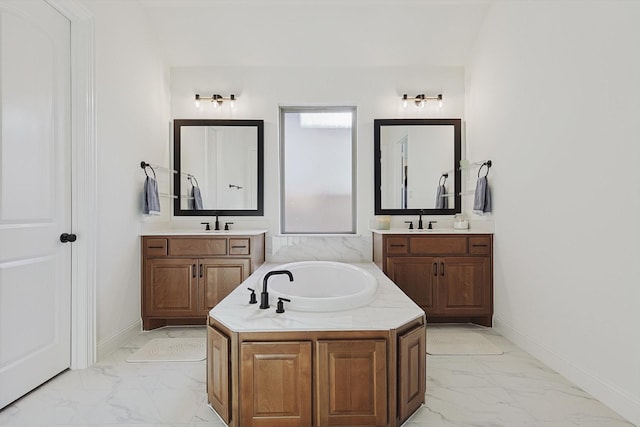 2613 Somerset Ln, Celina, TX 75009 - full bath with marble finish floors, a garden tub, two vanities, and baseboards