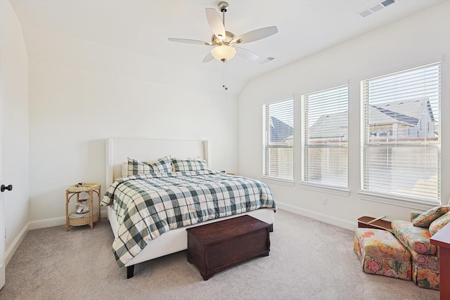 bedroom with light carpet, vaulted ceiling, and ceiling fan