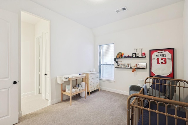 carpeted bedroom with lofted ceiling