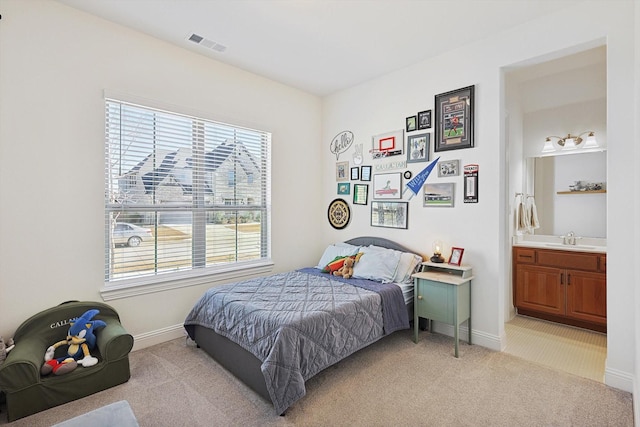 2613 Somerset Ln, Celina, TX 75009 - bedroom with light carpet, multiple windows, and a sink
