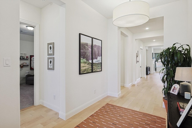 hallway featuring hardwood / wood-style flooring