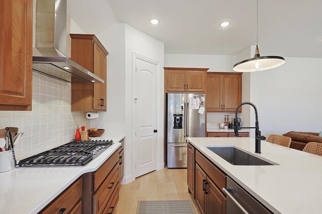 2613 Somerset Ln, Celina, TX 75009 - kitchen with stainless steel appliances, wall chimney range hood, a sink, light countertops, and brown cabinetry