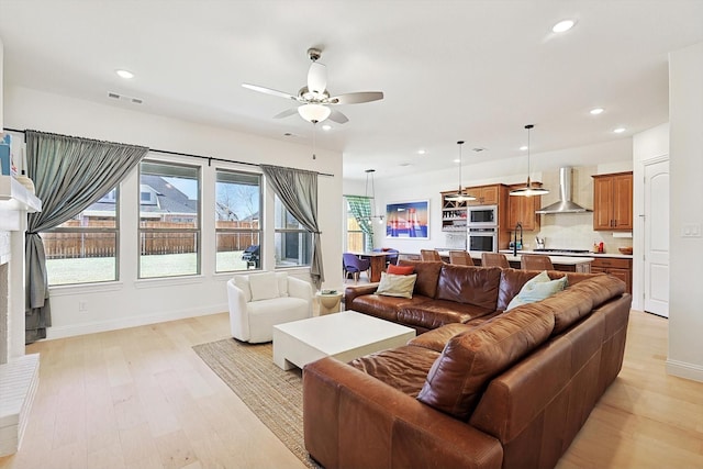 2613 Somerset Ln, Celina, TX 75009 - living room featuring light wood-style floors, ceiling fan, recessed lighting, and baseboards