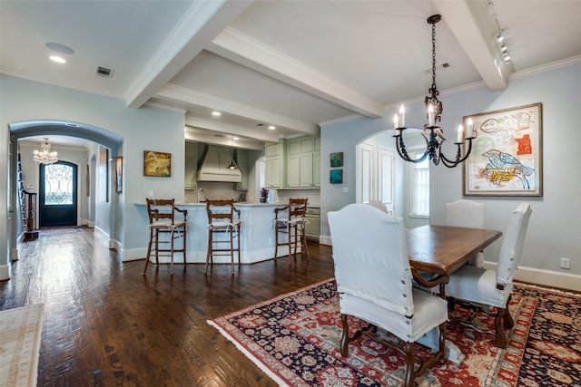 dining space featuring beamed ceiling, rail lighting, and a notable chandelier