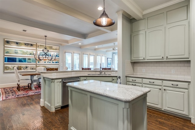 kitchen with stainless steel dishwasher, kitchen peninsula, hanging light fixtures, and a center island