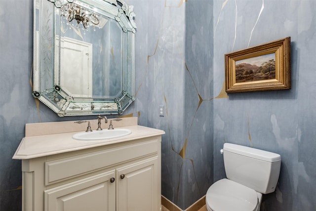 bathroom with toilet and vanity