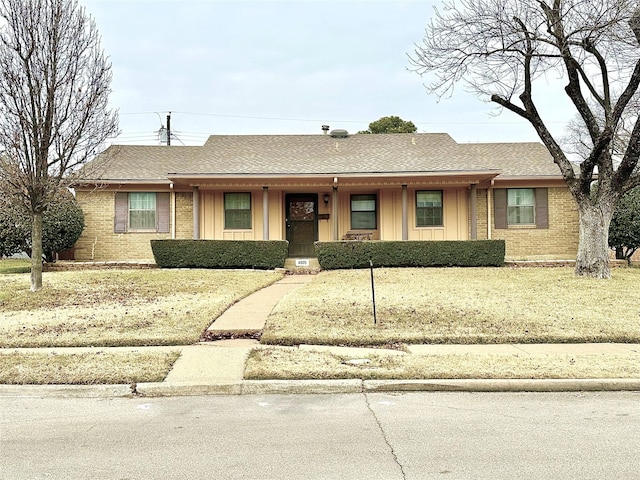 ranch-style home with a front lawn