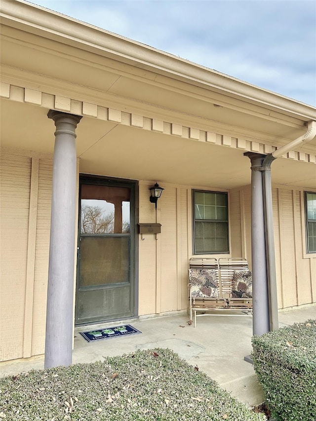 doorway to property featuring a porch