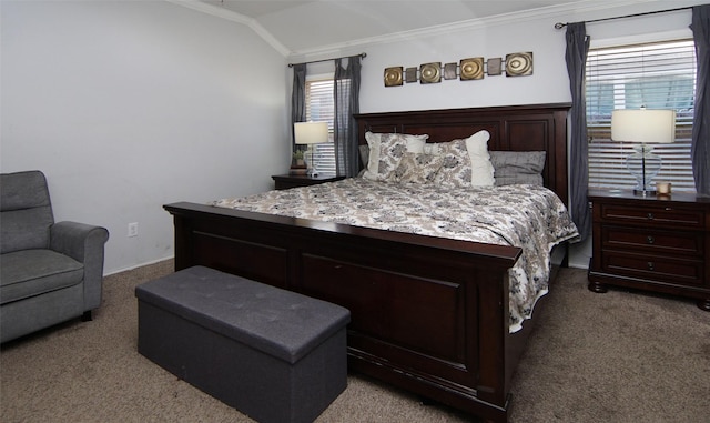 carpeted bedroom featuring ornamental molding and vaulted ceiling