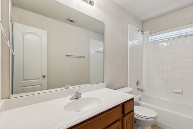 full bathroom featuring toilet, shower / washtub combination, and vanity