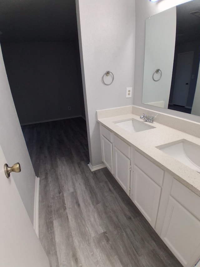 bathroom featuring vanity and wood-type flooring