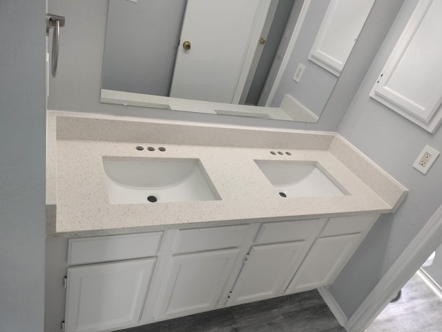 bathroom featuring vanity and wood-type flooring