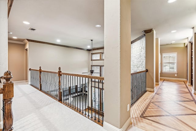 hall featuring parquet floors and crown molding