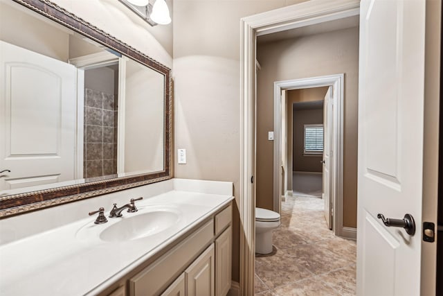 bathroom with toilet and vanity