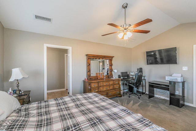 carpeted bedroom with ceiling fan and vaulted ceiling