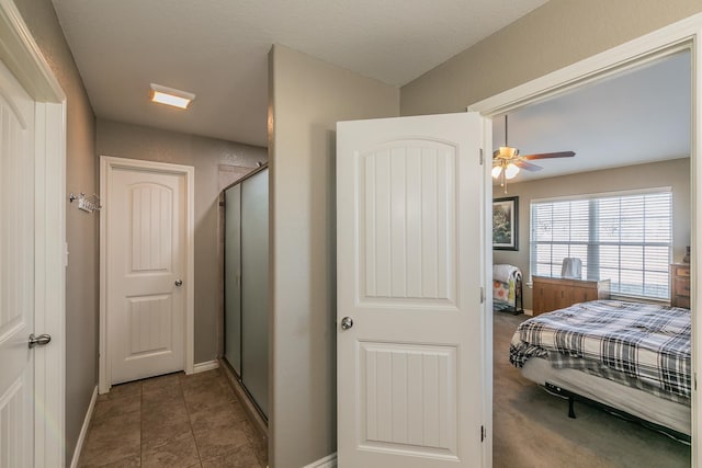 tiled bedroom with ceiling fan