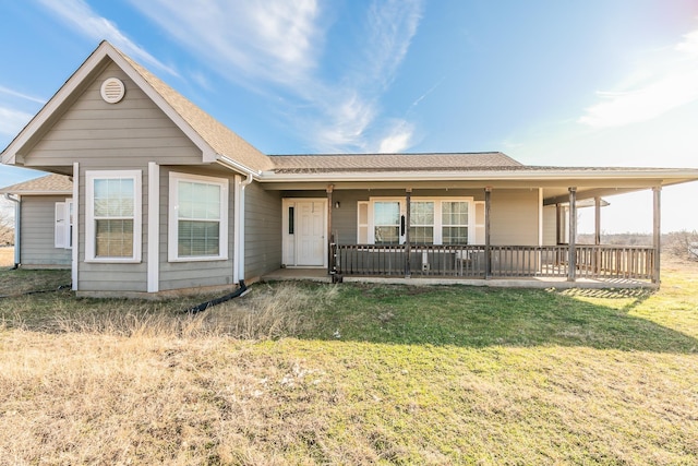 view of front of home featuring a front lawn and covered porch