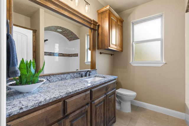 bathroom featuring a shower, a wealth of natural light, and toilet