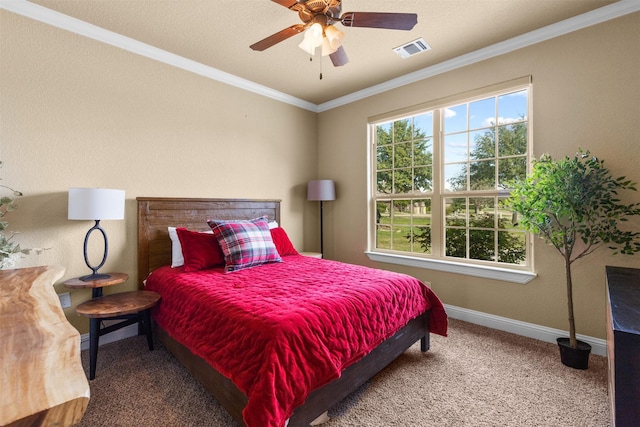 bedroom with ceiling fan, ornamental molding, and carpet flooring