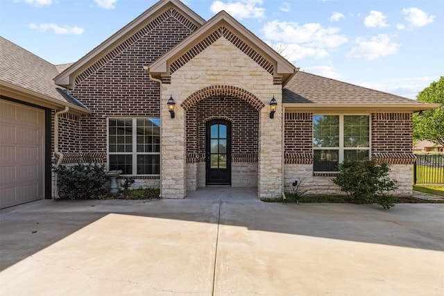 view of front of home with a garage