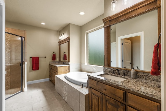 bathroom with tile patterned floors, vanity, and plus walk in shower