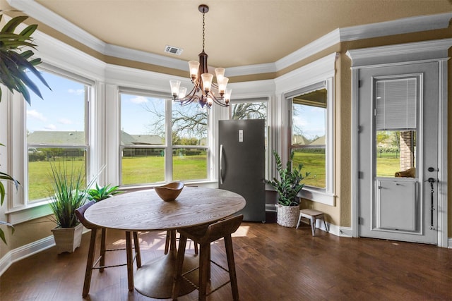 sunroom with a chandelier