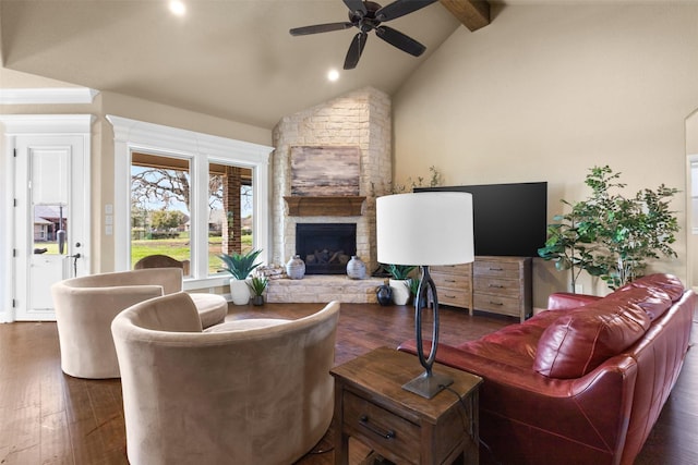 living room featuring a fireplace, lofted ceiling with beams, dark wood-type flooring, and ceiling fan