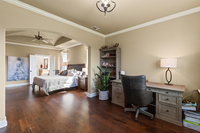 bedroom with ceiling fan, dark wood-type flooring, crown molding, and a raised ceiling