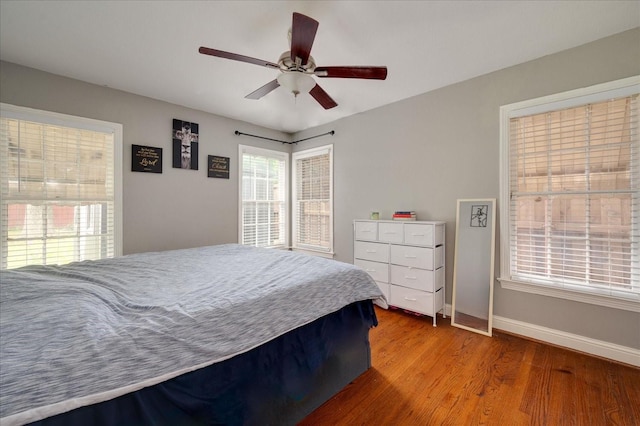 bedroom with ceiling fan and hardwood / wood-style floors